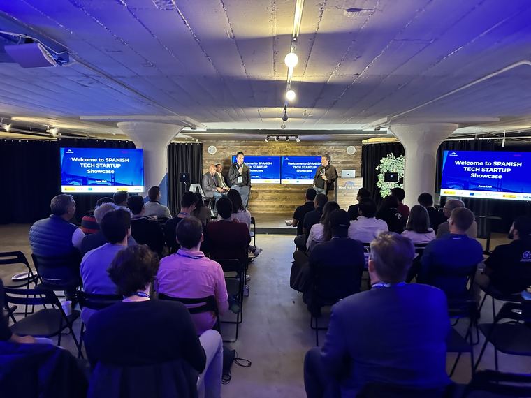 Audience seated in front of a screen reading Welcome to Spanish Tech Startup Showcase